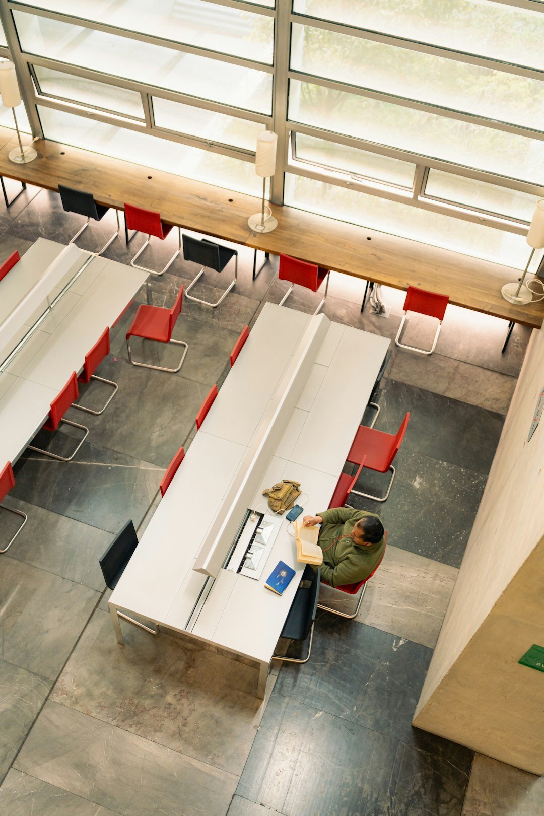 Overhead view of a diverse Mexican team collaborating around laptops