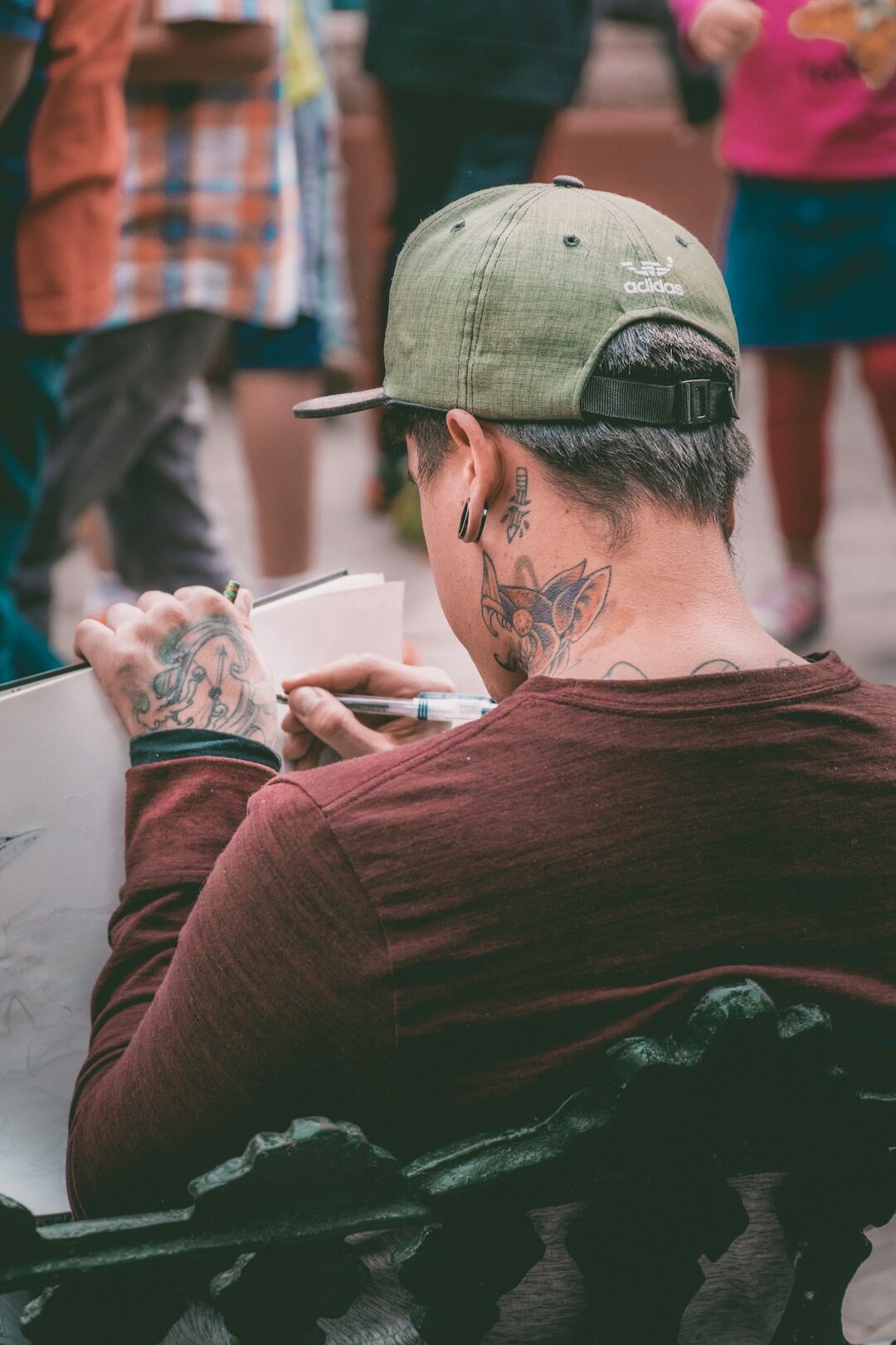 Mexican designer sketching a mobile app interface on a tablet