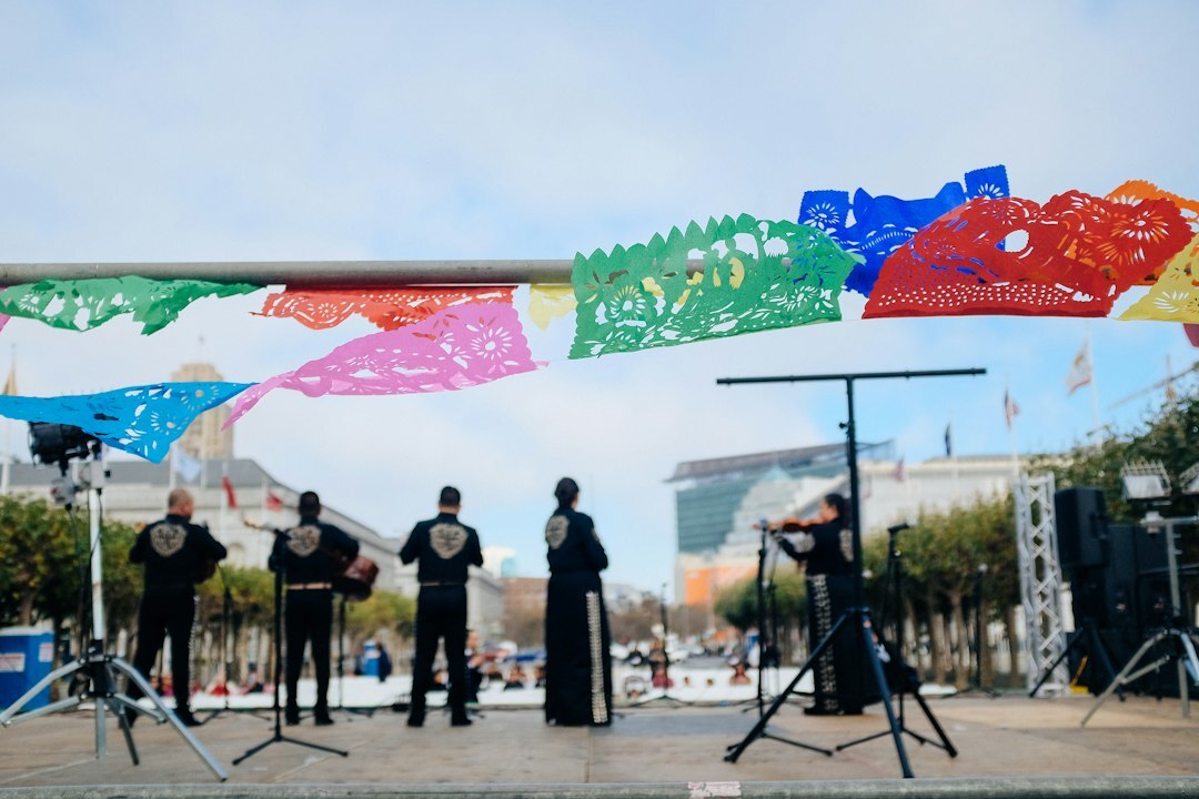 Group of Mexican graduates celebrating with certificates