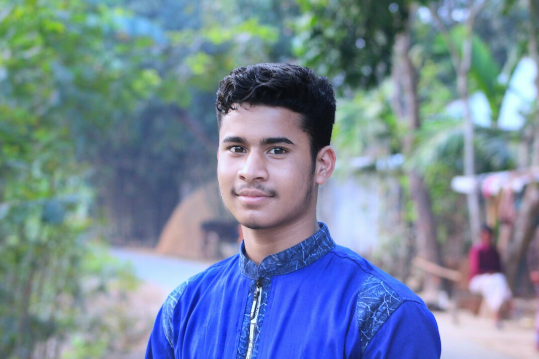Smiling young man in a blue shirt