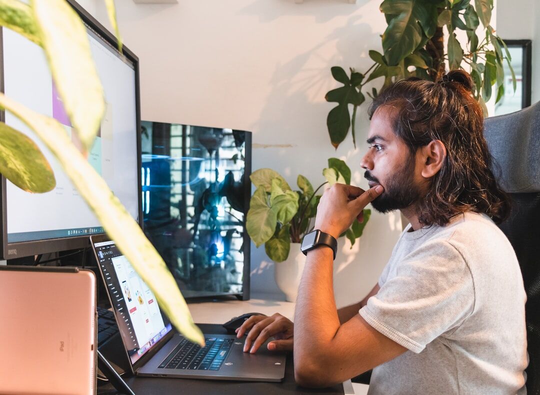 person coding on laptop at home