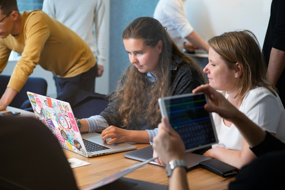 diverse group of spanish students learning to code