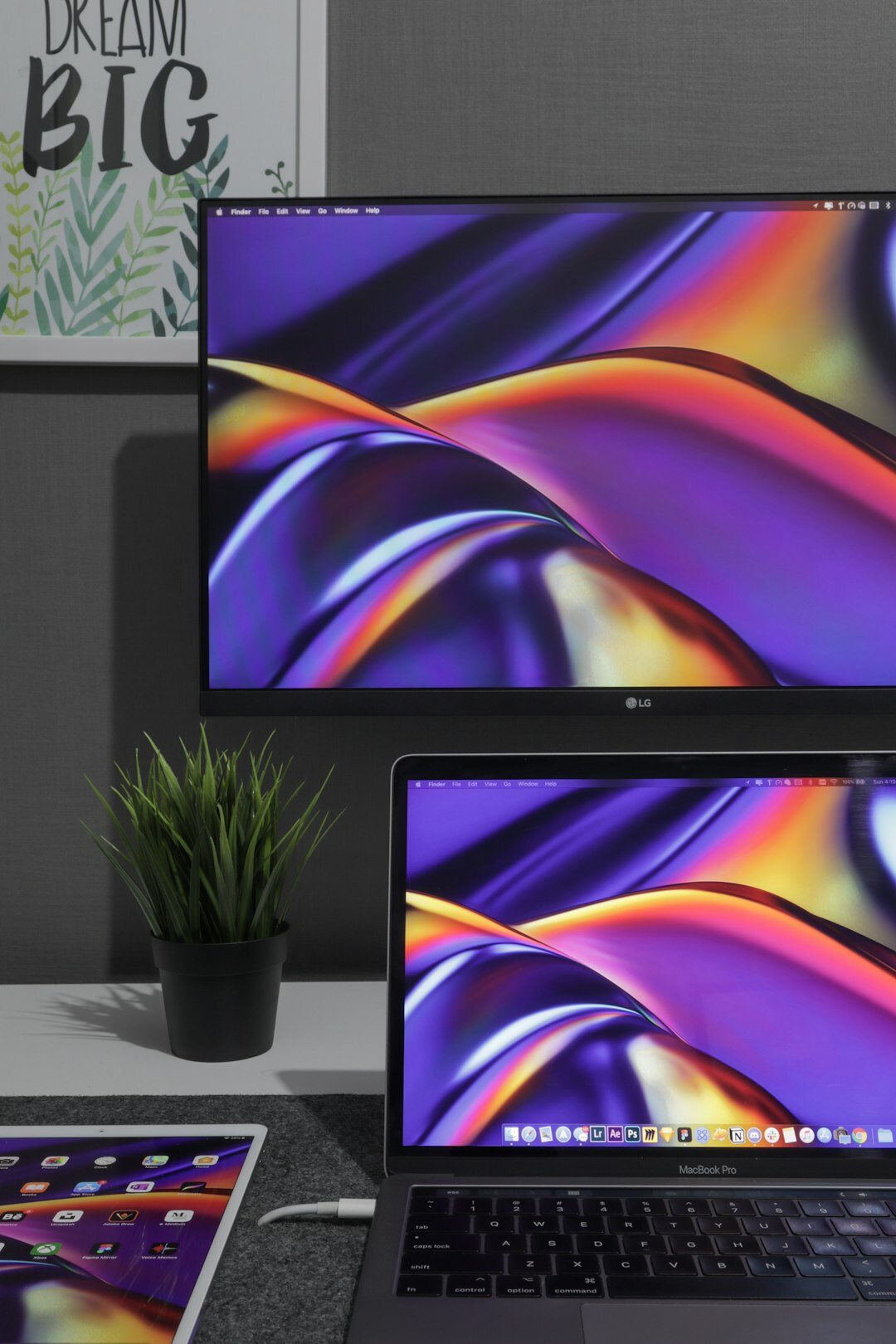 Computer screens showing colorful data charts and analytics dashboards
