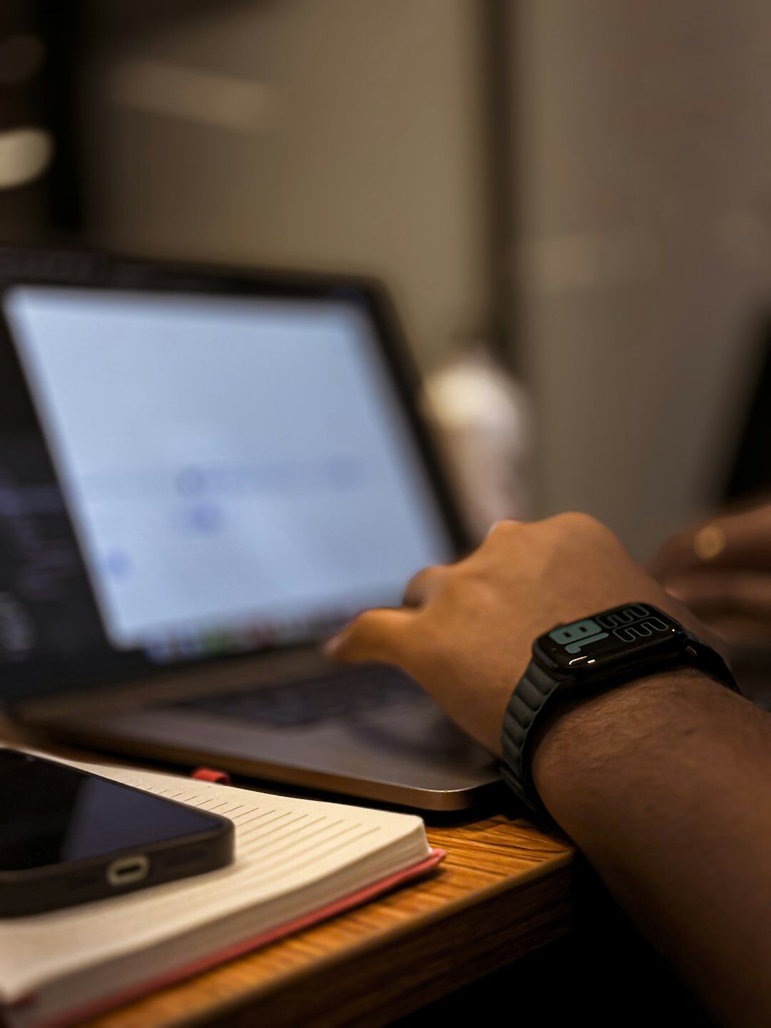 person coding on laptop