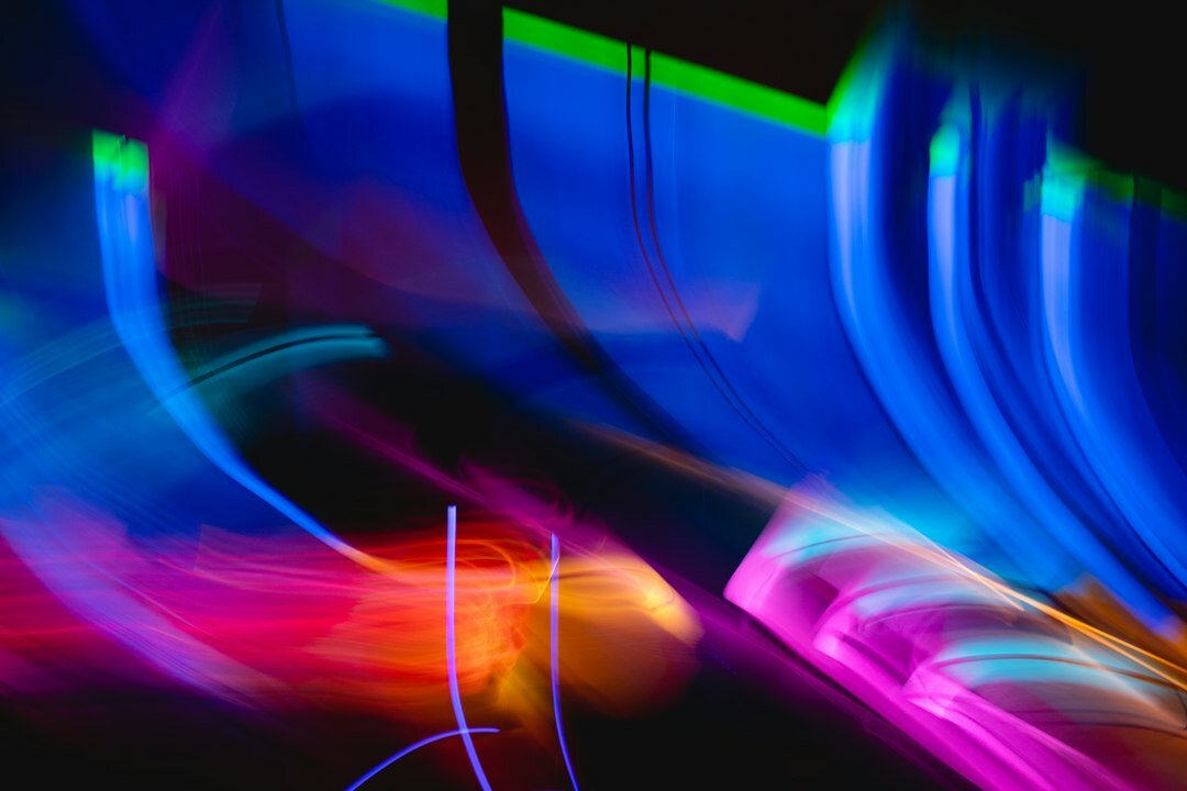 Computer monitor displaying colorful lines of web development code