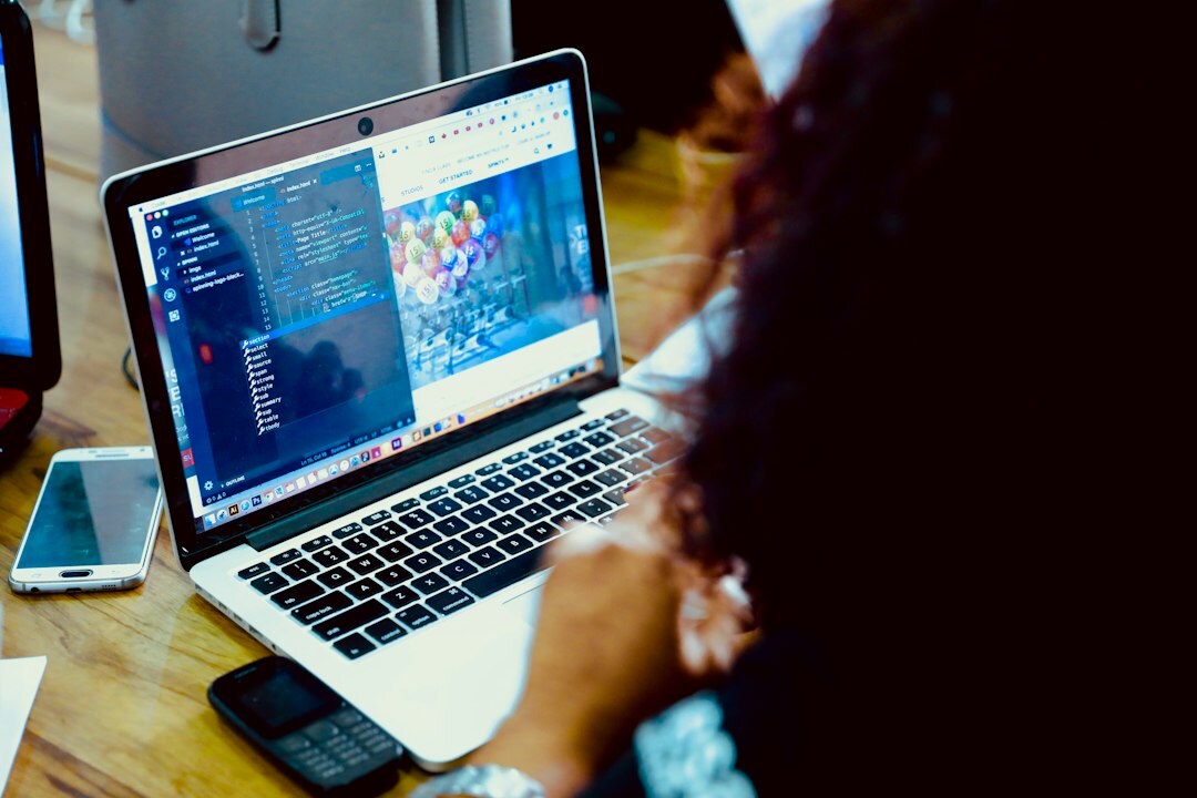 woman coding at laptop